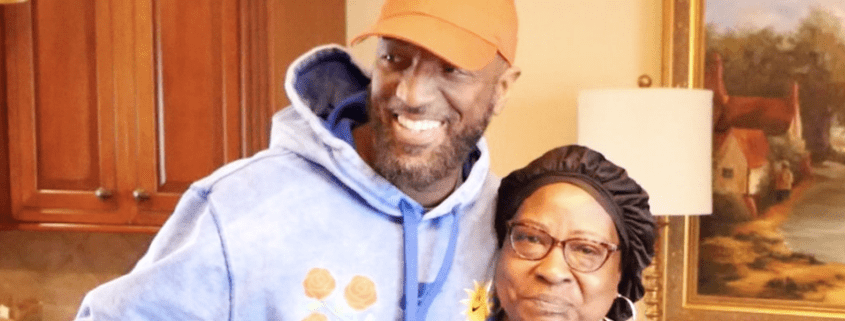 Smiling man and woman in cozy kitchen.